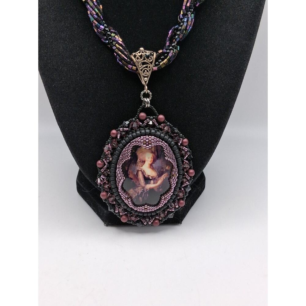 247.  Handcrafted necklace, purple tones
